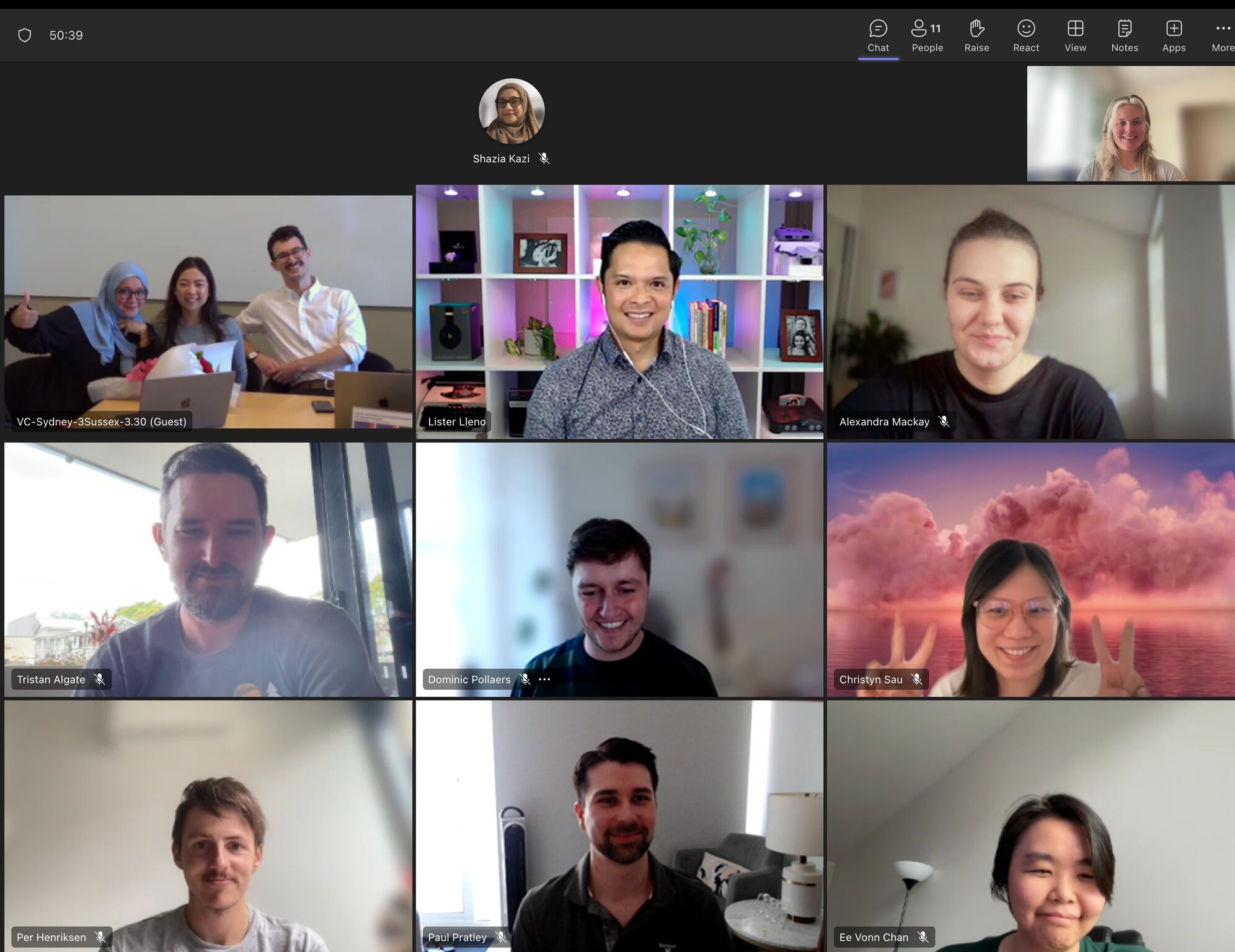 Microsoft Teams gallery view of a hybrid meeting with multiple participants on video.